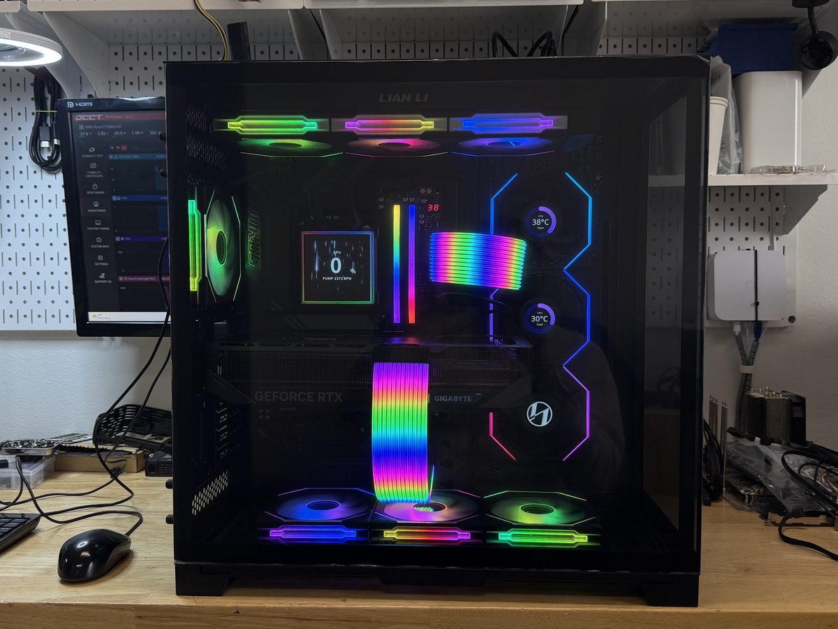 Black dual-chamber gaming PC with RGB lighting and sleeved cable extensions