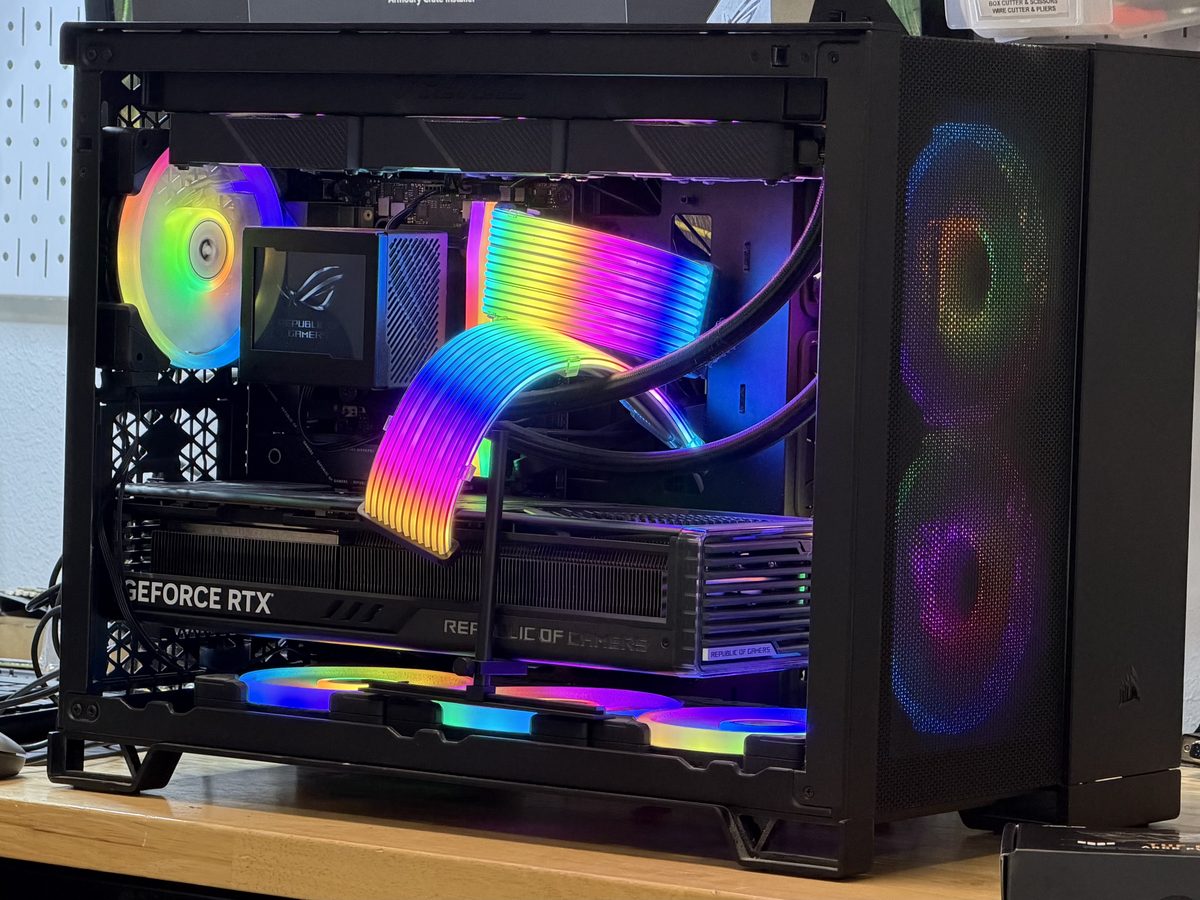 Black gaming PC with a GeForce RTX graphics card and RGB cable extensions