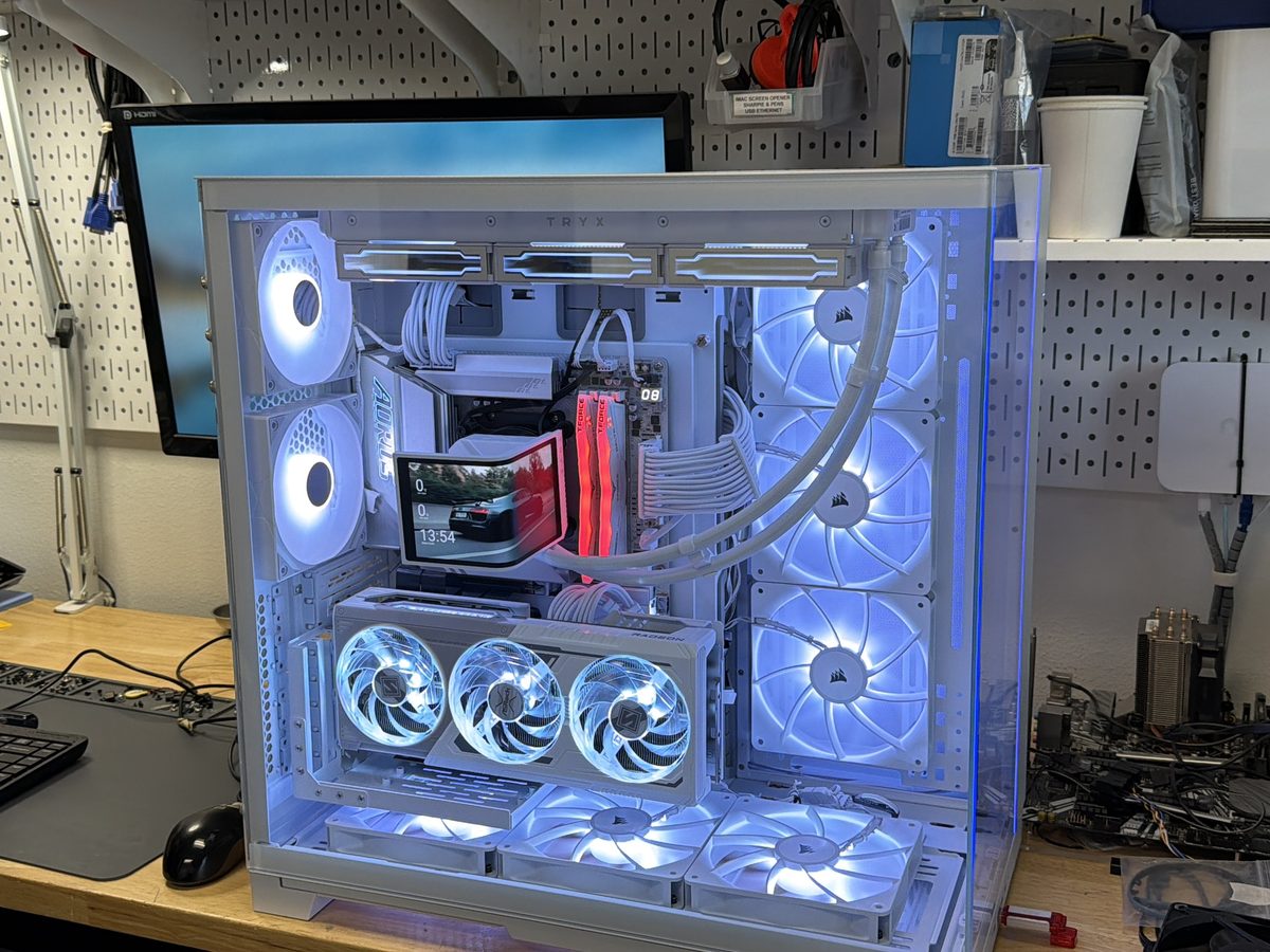 White dual-chamber gaming PC with a liquid-cooled processor and triple-fan graphics card